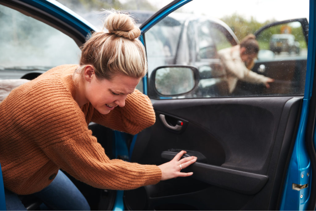 A lady in pain after a car wreck